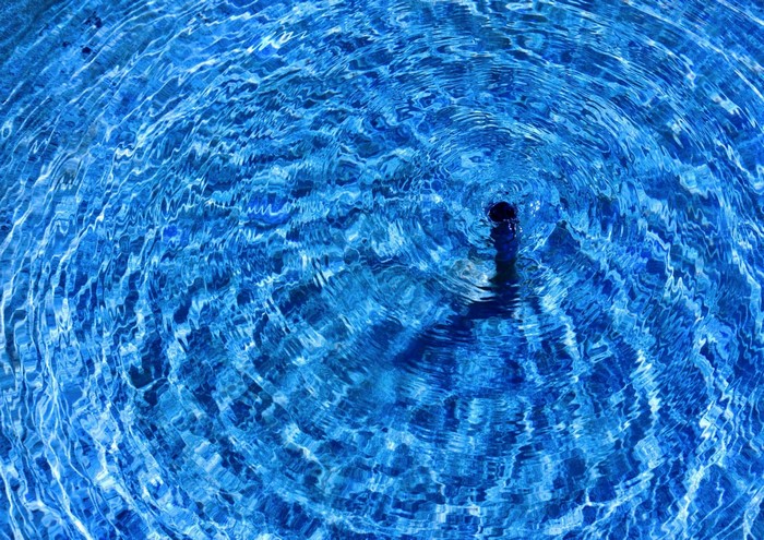 Ripples on blue water surface