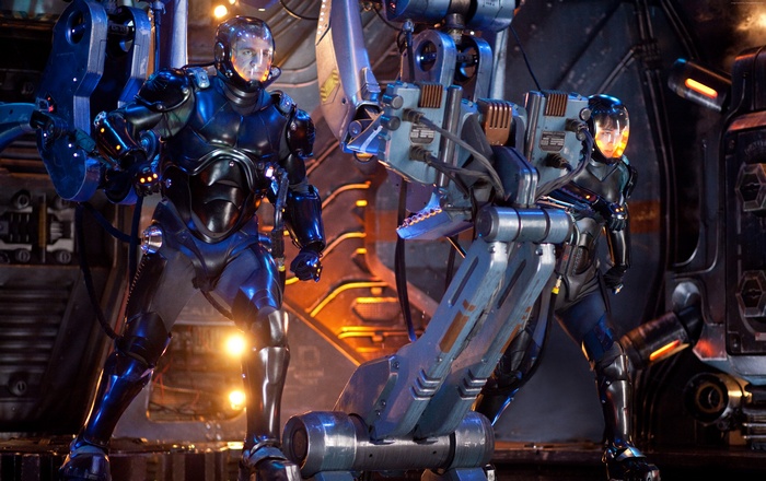 Two pilots in Jaeger suits in Pacific Rim: Uprising