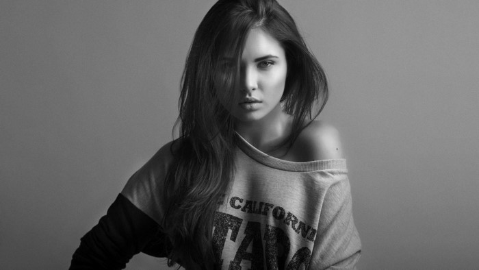 Woman with long hair wearing a sweatshirt