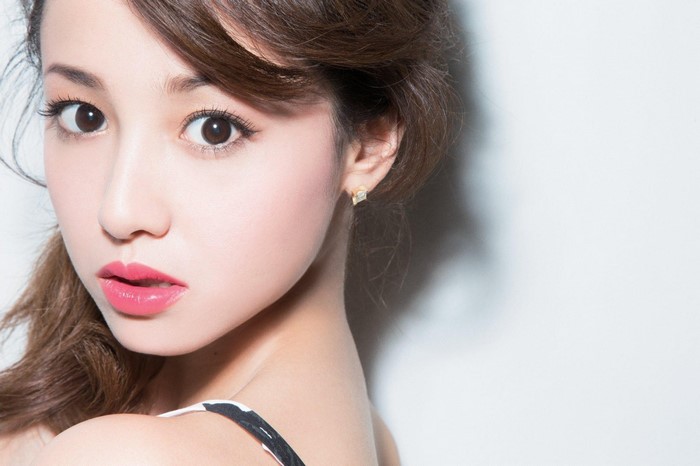 Close-up portrait of a young Asian woman with makeup