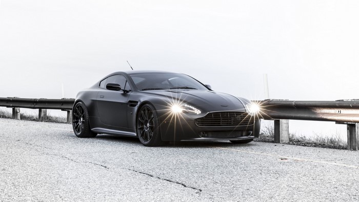 Matte black Aston Martin Vantage on a road