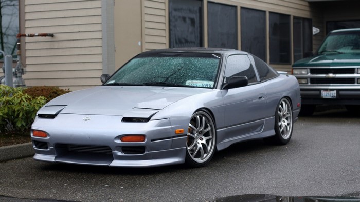 Silver Nissan 240SX coupe parked outside