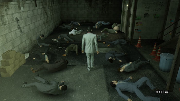 Man in Suit Standing Over Defeated Men in Alley