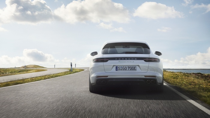 White Porsche Panamera Turbo S E-Hybrid Sport Turismo on a road