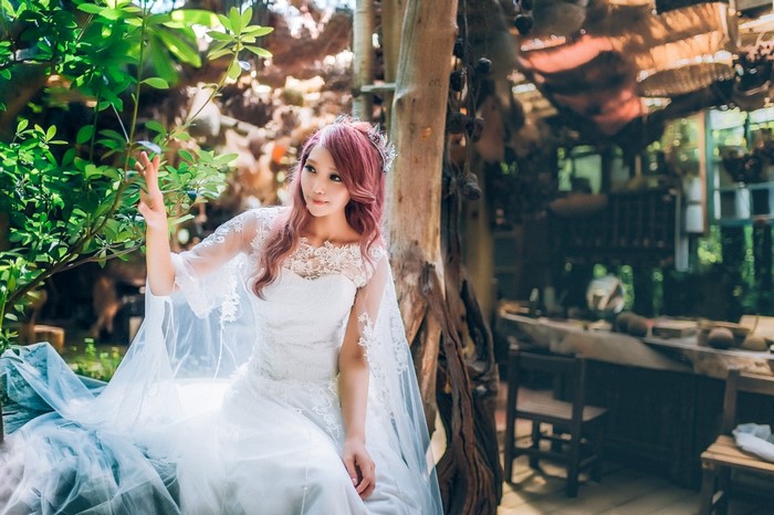Bride in Elegant White Dress in Rustic Setting