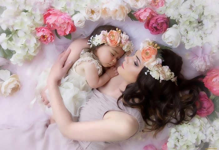 Mother and baby sleeping among flowers