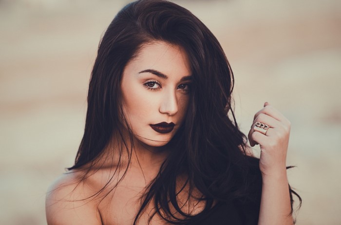 Portrait of Woman with Dark Hair and Intense Gaze