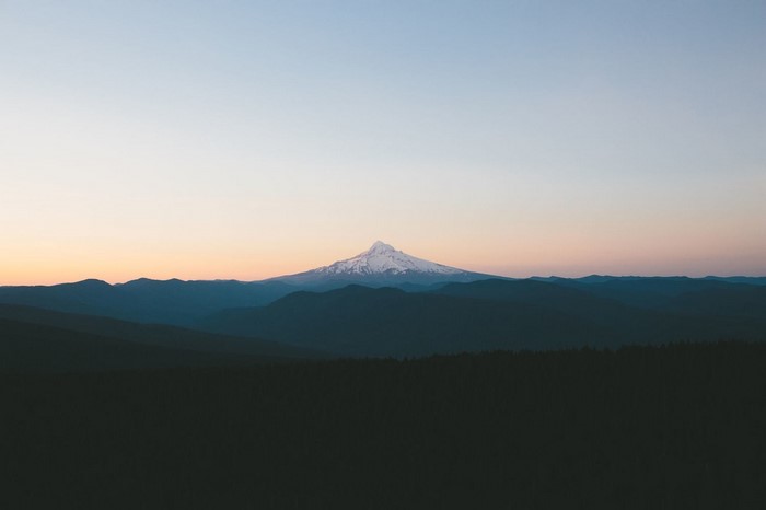 Snow-capped mountain range at sunrise