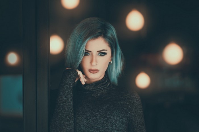 Woman with blue dyed hair and nose ring