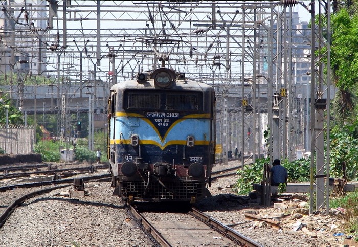 Electric locomotive on train tracks in India