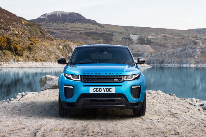 Blue Range Rover Evoque parked by a lake