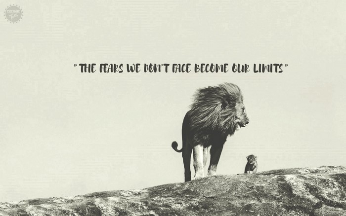 Lion and cub on a rock with motivational quote