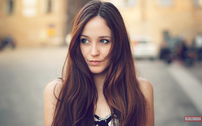 Portrait of a woman with long auburn hair