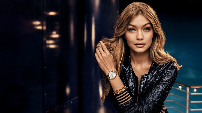 Gigi Hadid wearing a sequined jacket and watch