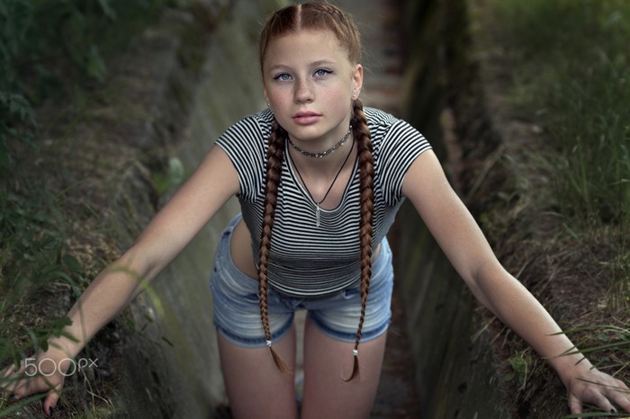 Young Redhead Girl in Striped Top and Jean Shorts