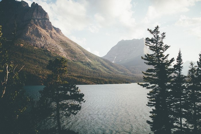 Mountains and lake with trees in the foreground