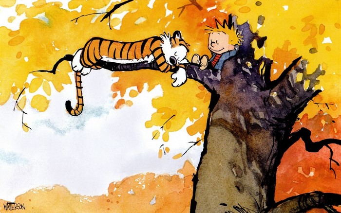 Calvin and Hobbes in a tree during autumn