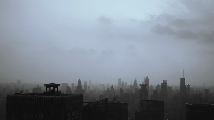 City skyline shrouded in mist at dawn