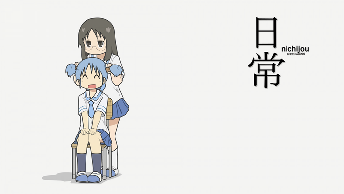 Two girls in school uniforms, one sitting and one standing, with Japanese text
