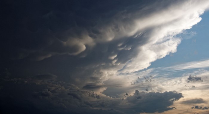 Mammatus clouds during sunset with blue sky