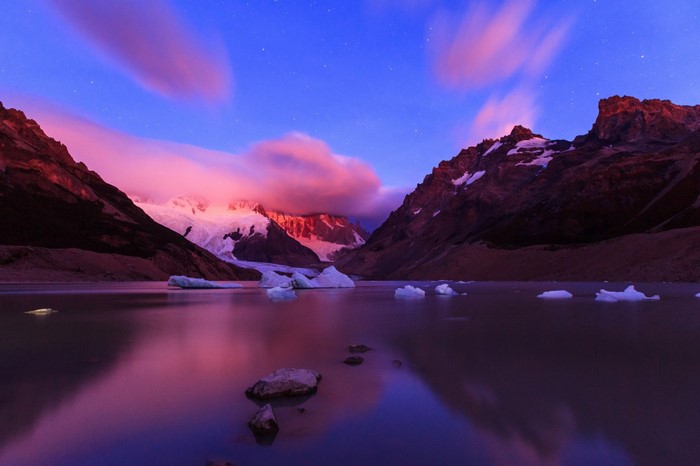 Mountain range reflected in a lake at twilight