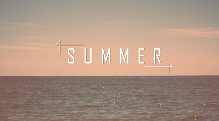 Summer typography over ocean at sunset