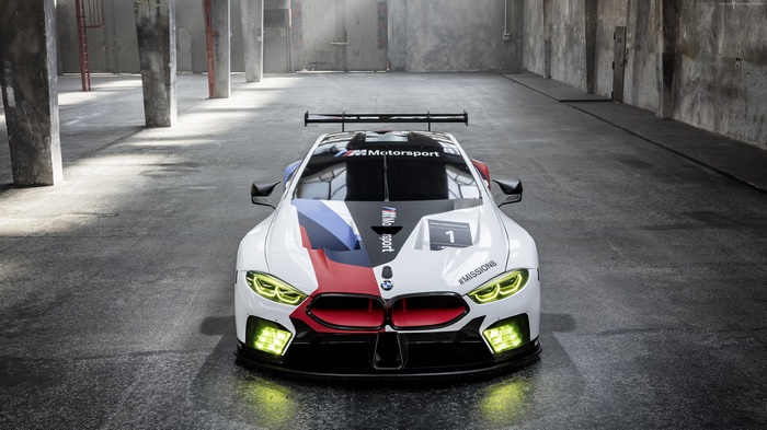 BMW M8 GTE race car in a warehouse