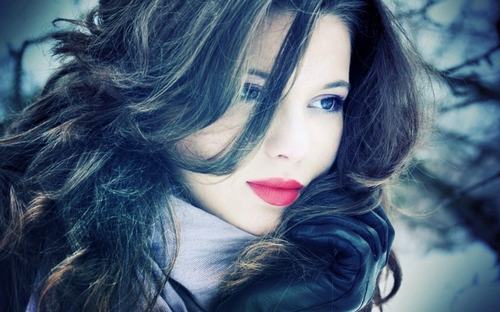 Woman with long dark hair and red lipstick