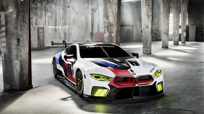 BMW M8 GTE race car in industrial setting
