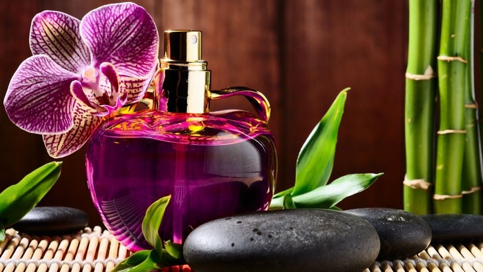 Purple perfume bottle with orchid and bamboo
