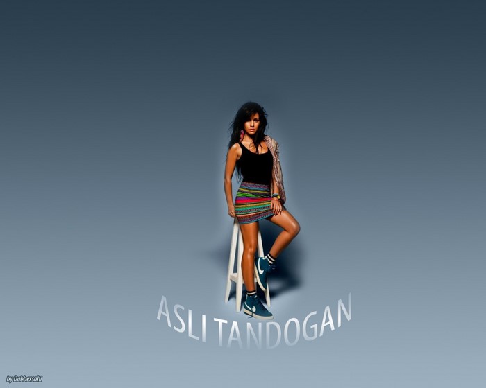 Asli Tandogan posing on a stool