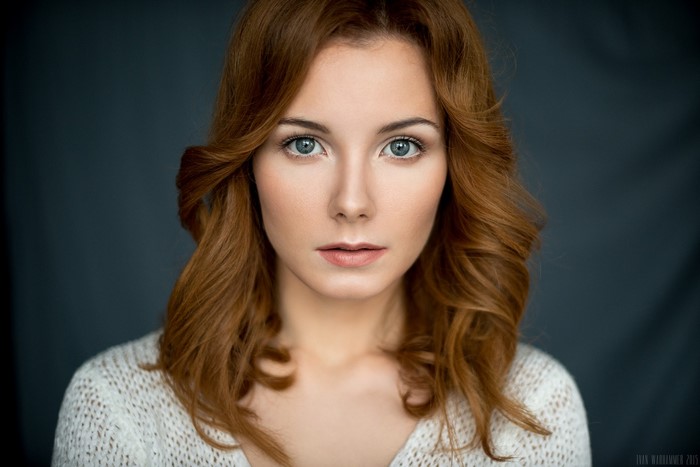 Portrait of Redhead Woman with Curly Hair