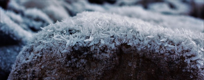 Macro shot of frost crystals on a rock