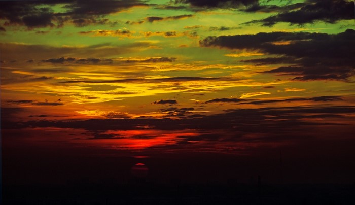 Colorful sunset with dramatic clouds over the horizon