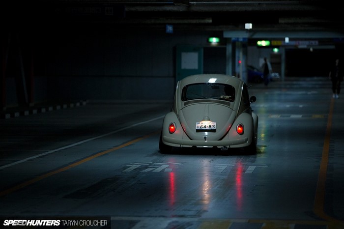 Volkswagen Beetle driving in a parking garage