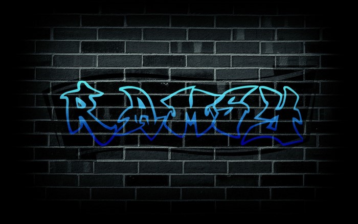 Graffiti art spelling "RAZZ" on a brick wall