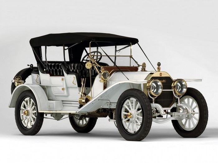 White Locomobile touring car with black soft top