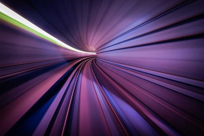 Abstract tunnel with purple and pink light streaks