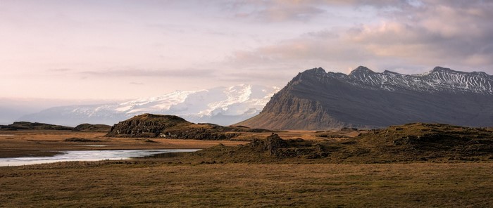 Mountain range with snow and river in Iceland