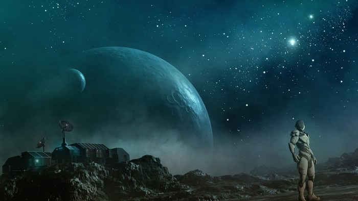 Astronaut on alien planet with large planet and moon in sky