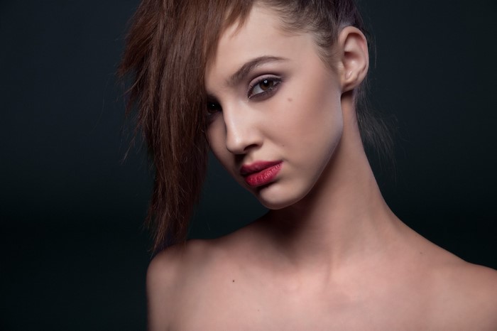 Woman with brown hair and red lipstick
