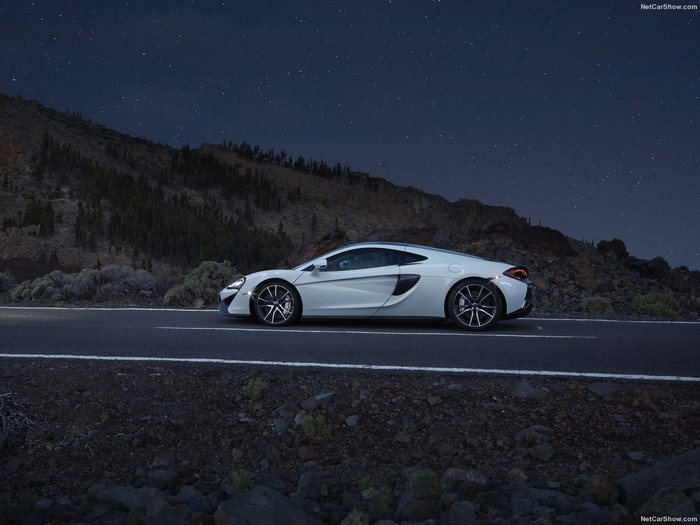 White McLaren 570GT parked on a road at night