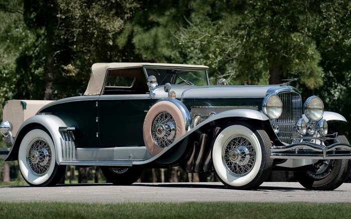 Green and silver Duesenberg Model J convertible touring car