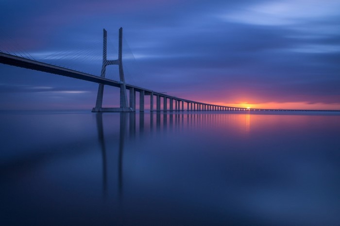 Vasco da Gama Bridge at sunset over the Tagus River
