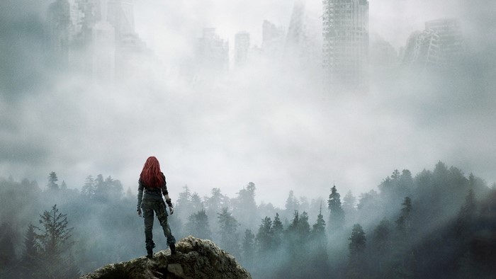 Woman from The 100 overlooking a foggy, ruined city