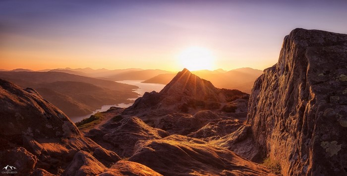 Sunrise over mountains and a lake