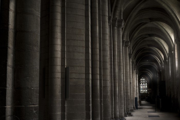 Monochrome interior of a Gothic cathedral with columns and arches
