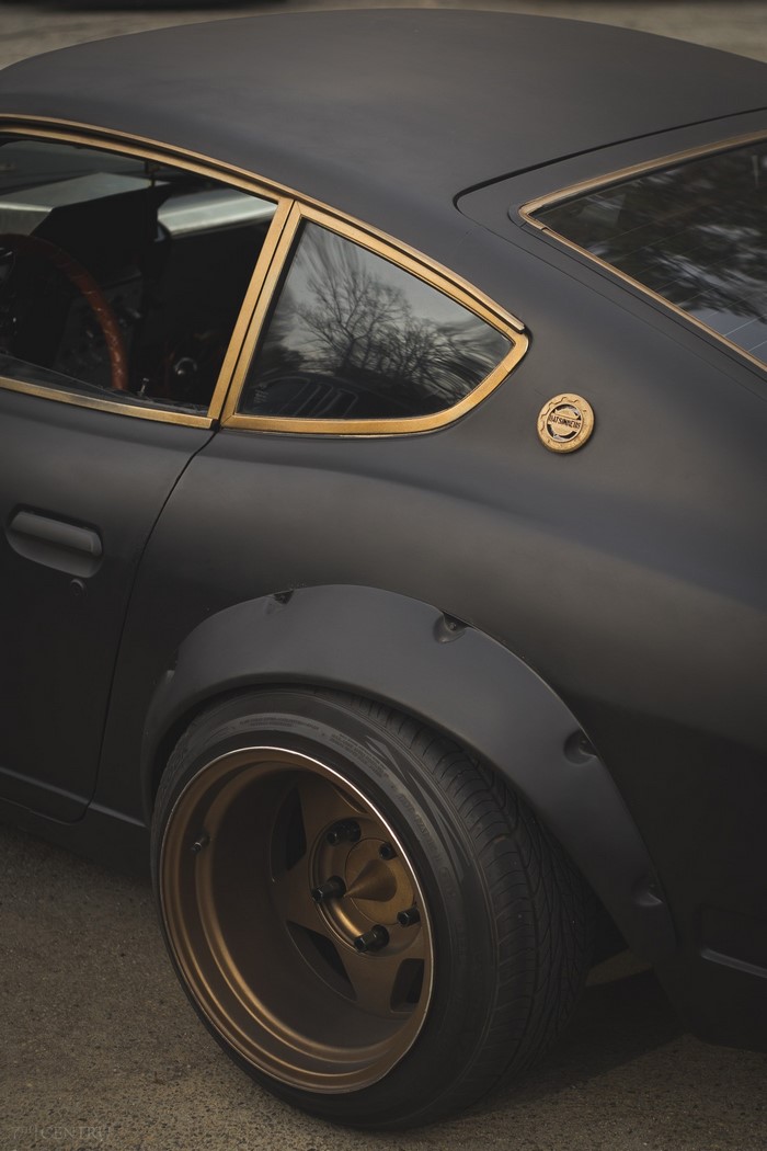 Matte black Datsun 240Z with gold trim and custom wheels