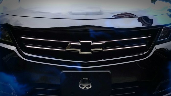 Black Chevrolet Impala with Skull License Plate Frame