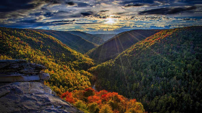 Valley with autumn foliage and sunbeams